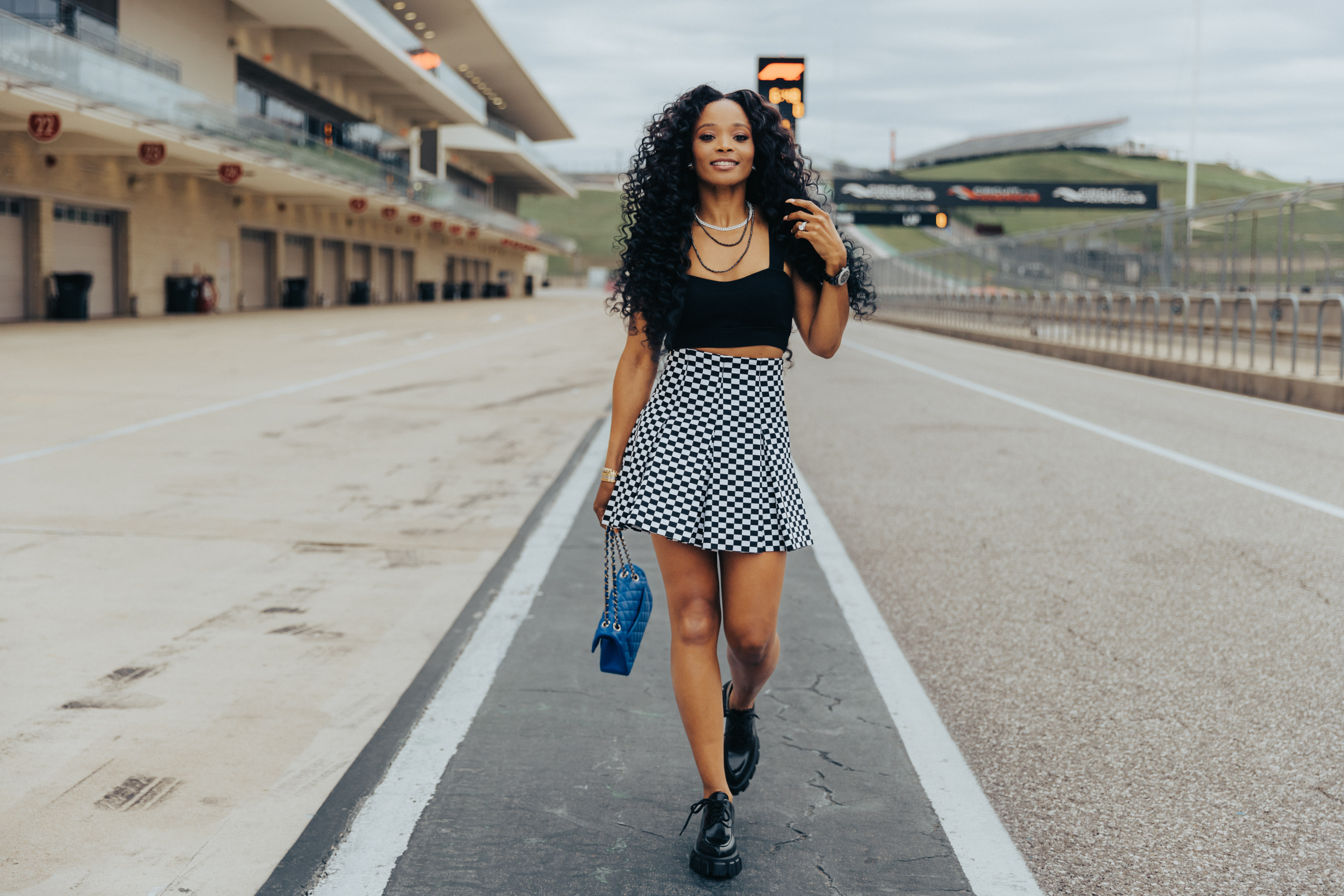 Checkers, Leather, and the Perfect Kicks: Loreal Sarkisian on the Best  MotoGP Weekend Fits - Home of the World Championships