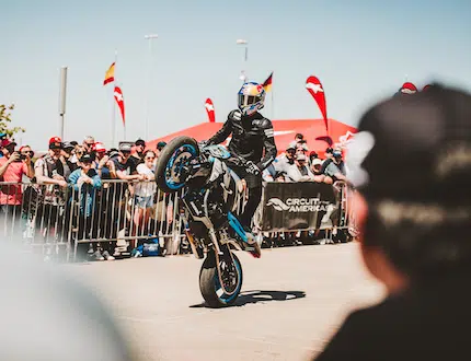 Biker Doing Stunts in COTA Track Close to Audience
